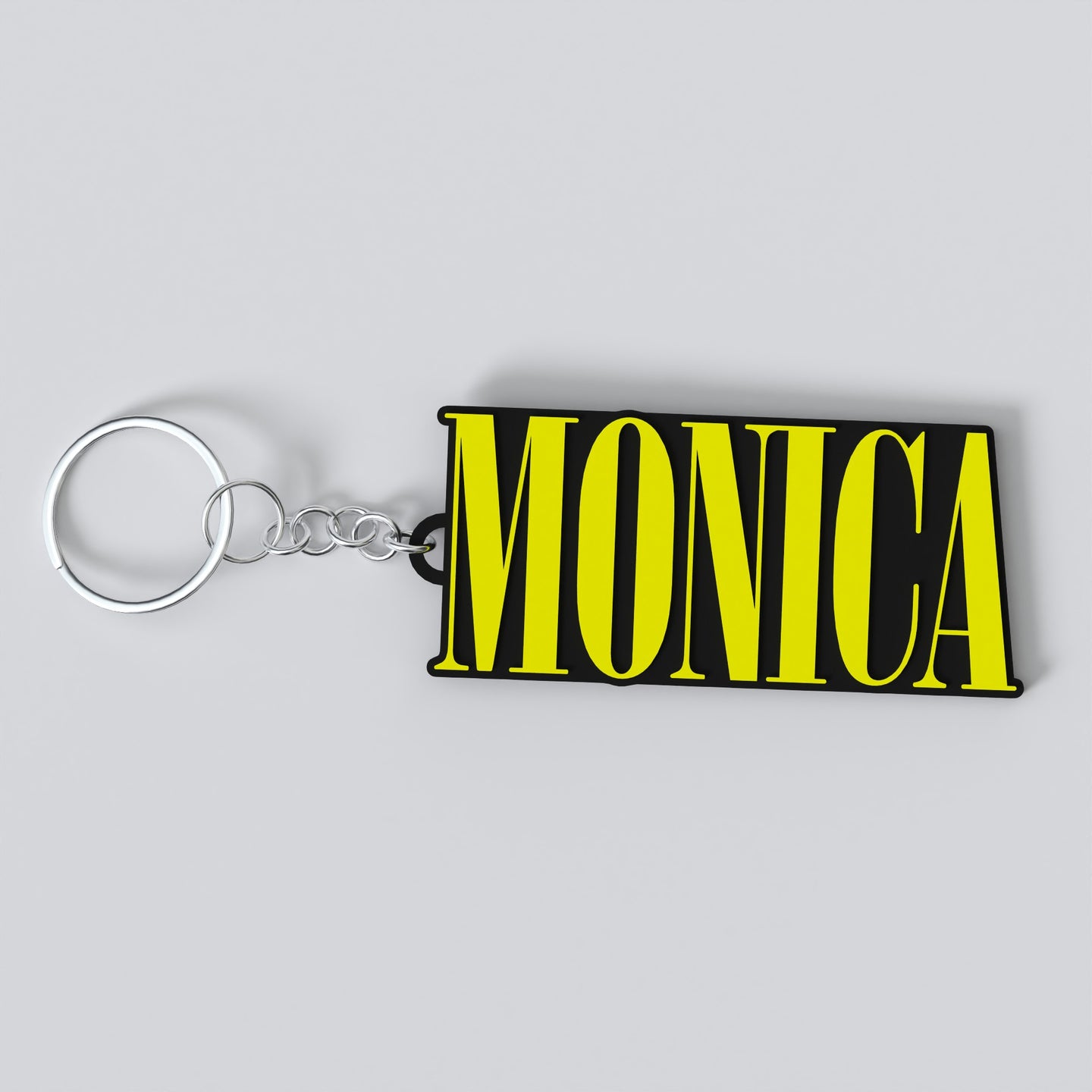 Custom Nirvana keychain with the name "MONICA"