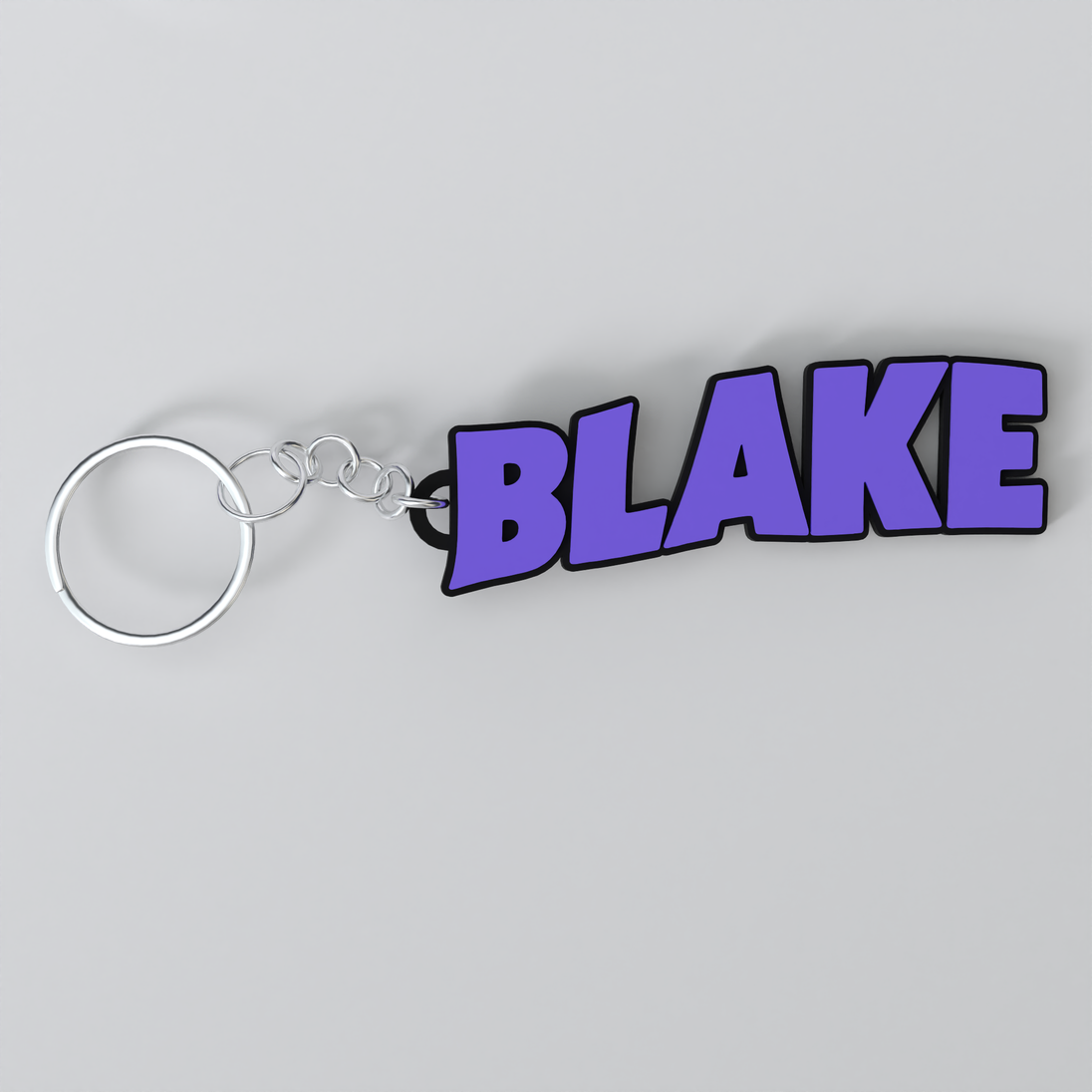 A custom Black Sabbath keychain with the name Blake printed in purple on a white background.