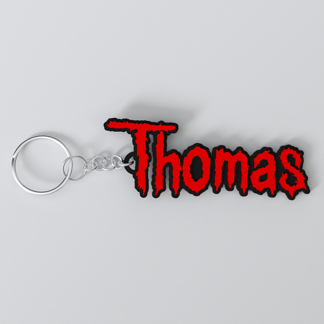 Customized Slipknot keychain with the names 'Thomas'.