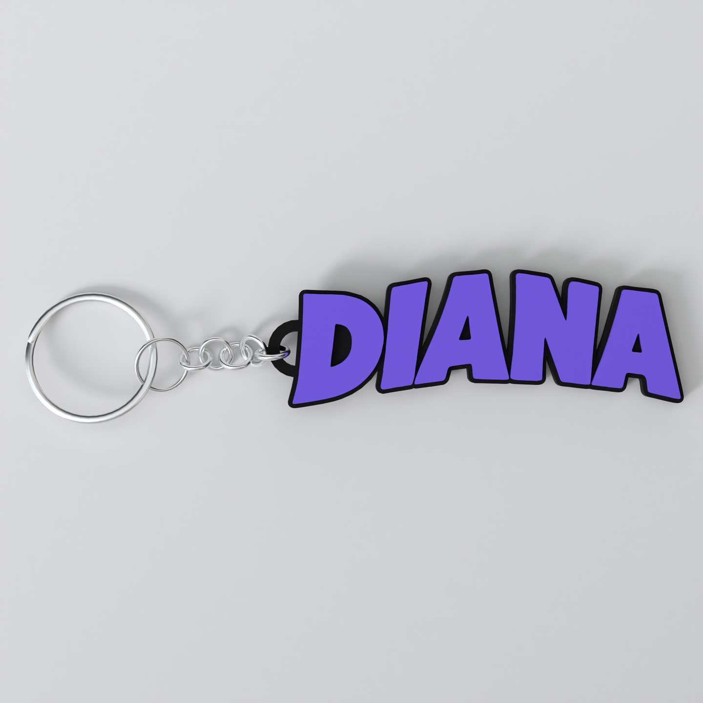 A custom Black Sabbath keychain with the name DIANA printed in purple on a white background.