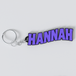 A custom Black Sabbath keychain with the name HANNAH printed in purple on a white background.
