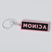 Black pink custom keychains with the names "MONICA"