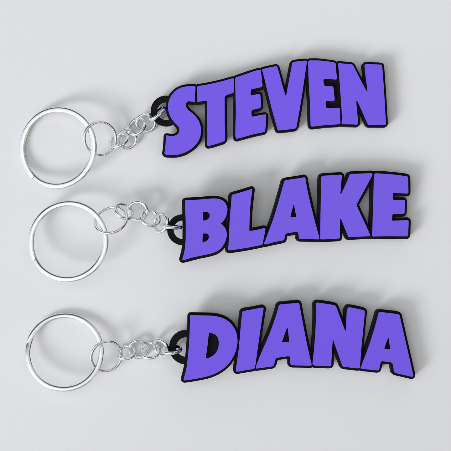 Three custom Black Sabbath keychains with the names STEVEN, BLAKE, and DIANA printed in purple on a white background.