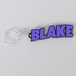 A custom Black Sabbath keychain with the name Blake printed in purple on a white background.