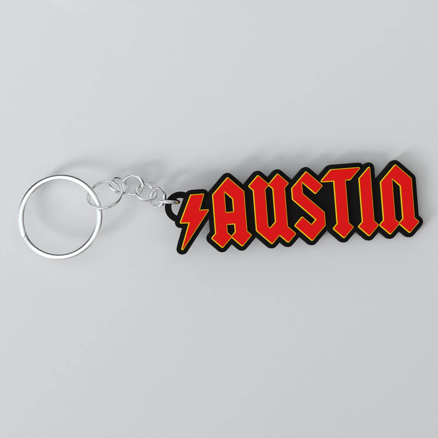 Custom ACDC keychain with the name 'AUSTIN'.