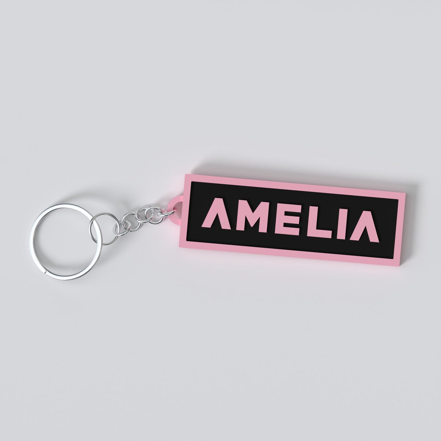 Black pink custom keychains with the names "AMELIA"