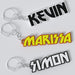 Custom KISS keychains with the names Kevin, Marissa, and Simon printed in bold lettering on a white background.