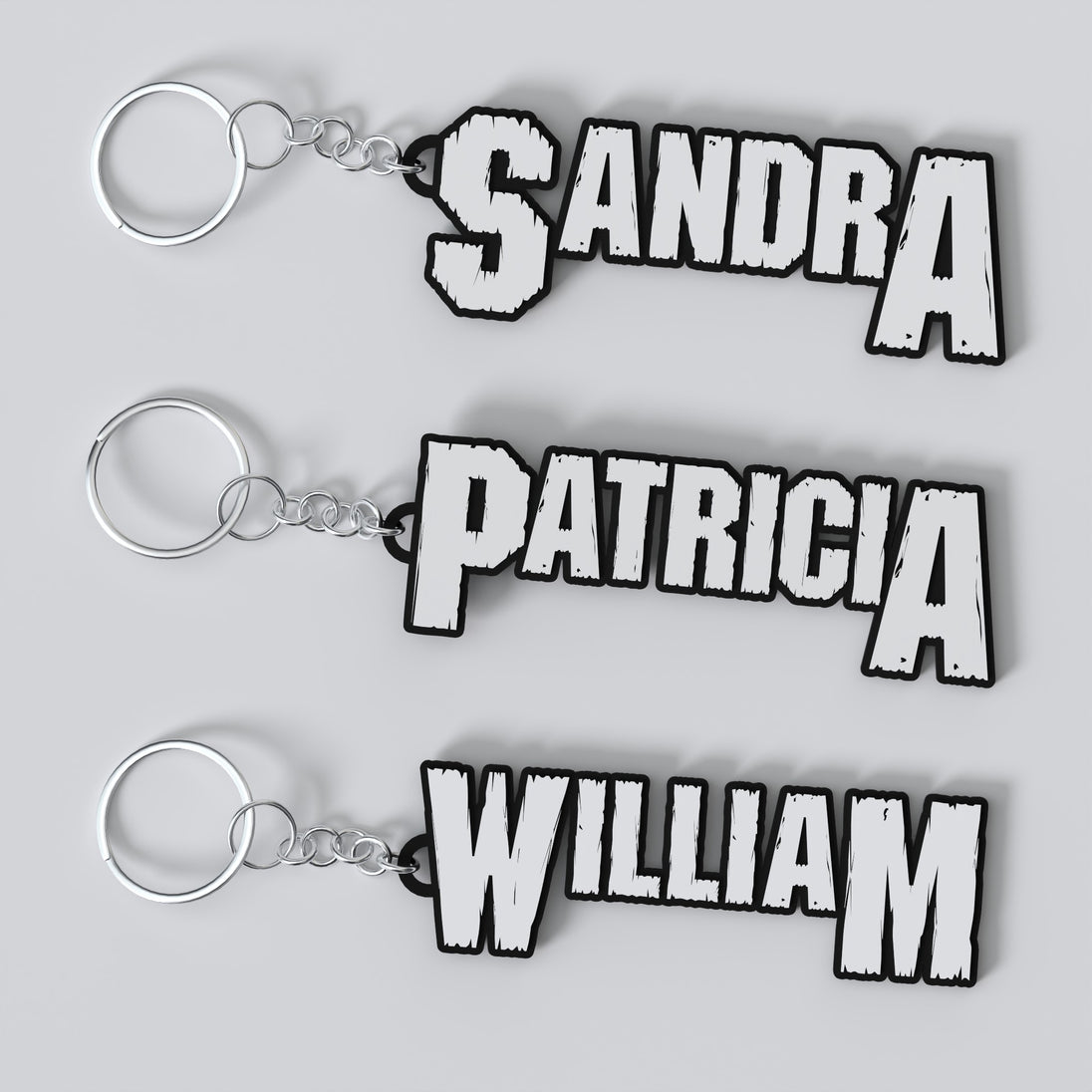 Three custom Pantera keychains with different names printed on them, displayed on a white background.